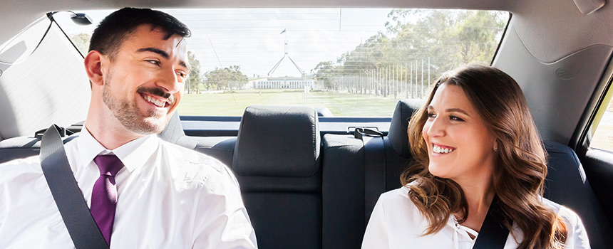 A couple sitting in a Canberra Elite taxi.